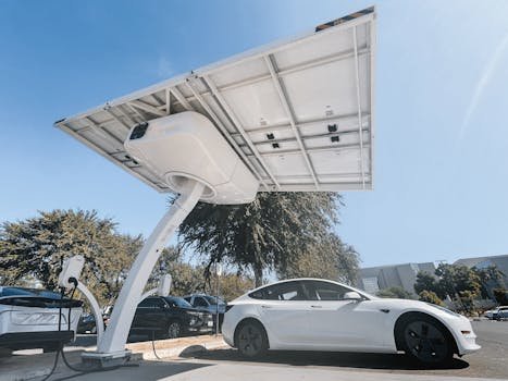 Electric car charging under a modern solar panel station, showcasing clean energy technology.